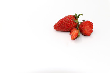  Fresh strawberries placed on a white background.