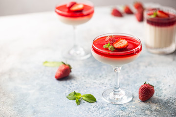 Italian panna cotta dessert with strawberry sirup and mint leaf