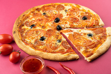 pizza close-up, isolated, against a colored background. whole pizza 