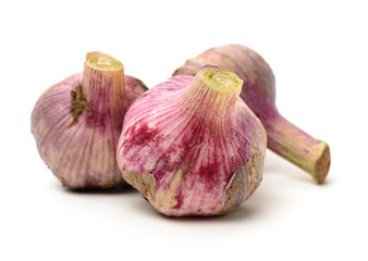 Fototapeta premium Fresh young garlic isolated on white background