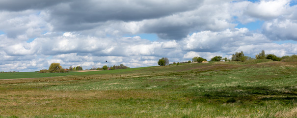 panorama of landscape in Denmark with blue sky and clouds