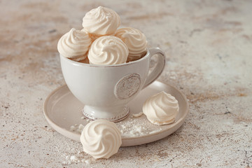French dessert Meringue prepared from whipped with sugar and baked eggs.A cup of home-made...