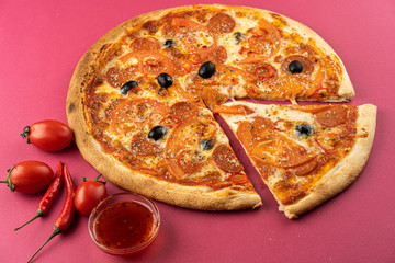 pizza close-up, isolated, against a colored background. whole pizza 