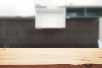 Wood desk space and blurred of kitchen background. for product display montage. business presentation.