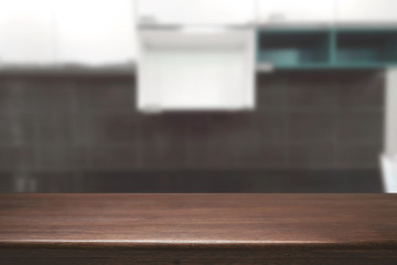 Obraz premium Wood desk space and blurred of kitchen background. for product display montage. business presentation.