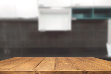 Wood desk space and blurred of kitchen background. for product display montage. business presentation.