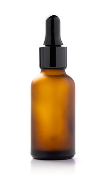 brown glass dropper serum bottle isolated on white background