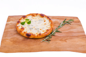 Delicious fresh pizza with cream on a wooden tray, board, dish. The object is isolated on a white background.