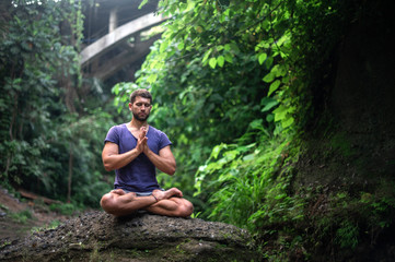 Man practice Yoga practice and meditation outdoor.