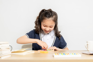 Asian primary school girls taking math classes