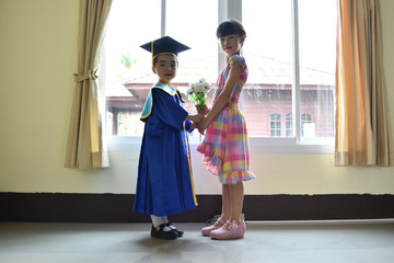 The older sister joins the sister in kindergarten clothes.