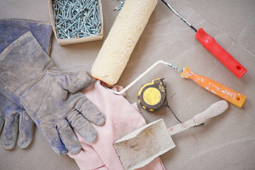 House work. Tools for fixing the houseworks such as gloves, painter and paint brush.
