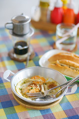 Egg pan. Breakfast in Vietnamese food style such as egg pan, Banh Mi or Vietnamese pork roll and Vietnamese dripped coffee.