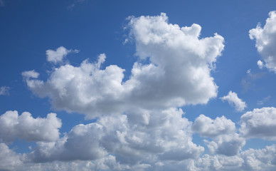 Naklejka na ściany i meble Blue sky with textured clouds in
