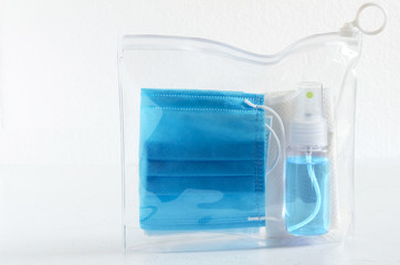 Set in the vacuum package. Paper napkin, medical mask, decontamination agent in a spray bottle.