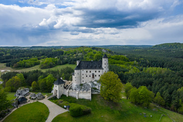 Fototapeta na wymiar Aerial view of Castle Bobolice, one of the most beautiful fortresses on the Eagles Nests trail. Medieval fortress in the Jura region near Czestochowa. Poland.
