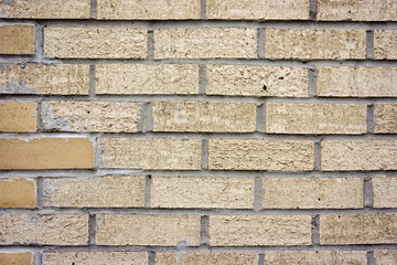 light brown brick wall background texture.