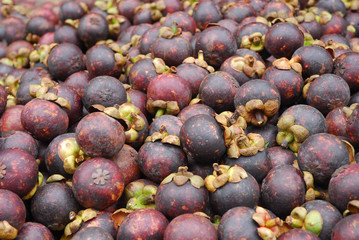 close up on fresh mangosteen fruit as food background