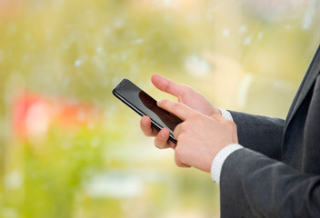 Businessman holding the smart phone.
