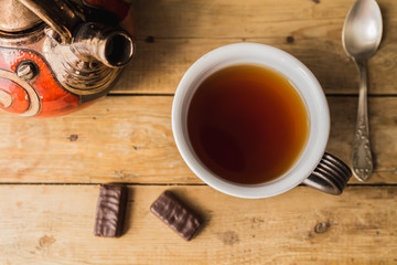 red tea-set on a wooden table.