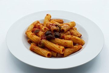 Maccheroni with olive sauce and parmesan, isolated on white. Italian pasta