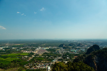 Fototapeta na wymiar High green mountain with city view