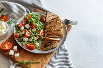 Close-up on a salad with chicken and tomato