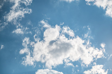 A low angle shot of a beautiful cloudscape on a blue sky background