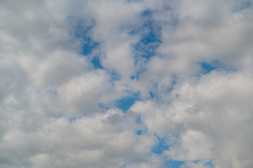 A low angle shot of a beautiful cloudscape on a blue sky background