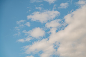 A low angle shot of a beautiful cloudscape on a blue sky background