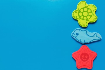 flatlay toys on a blue background. Marine life.Mockup for design with copy space.