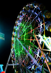 Night View of Amusement park rides, Ferris Wheel in diwali fair
