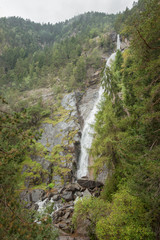 waterfall among the misty forest in Italy