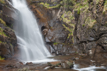 Obraz premium waterfall among the misty forest in Italy