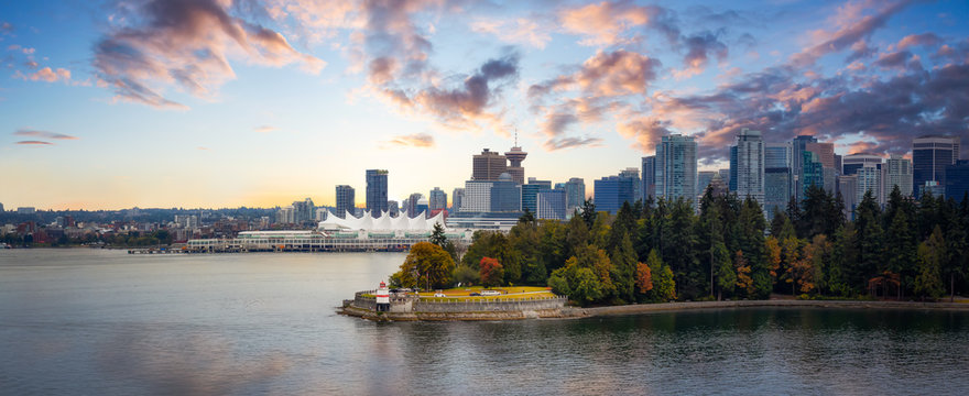 Vancouver, British Columbia, Canada. Beautiful Panoramic View of Modern Downtown City, Stanley Park and Coal Harbour. Colorful Sunrise Sky Composite. Cityscape Panorama