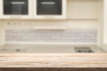 Wood desk space and blurred of kitchen background. for product display montage. business presentation.
