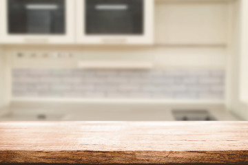 Wood desk space and blurred of kitchen background. for product display montage. business presentation.