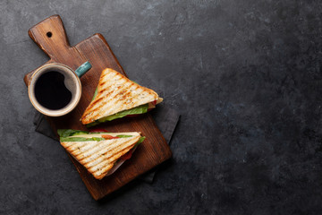 Coffee cup and club sandwich