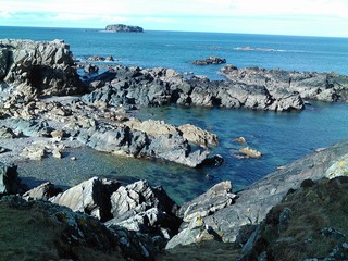 Fototapeta na wymiar rocky beach in a blue tone the North Atlantic ocean Ireland