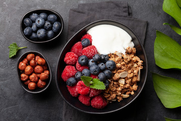 Healthy breakfast with granola, yogurt and berries