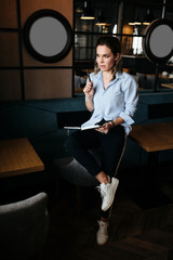 Pretty woman thinking and make records in daily planner. Casual style clothes - 346097812