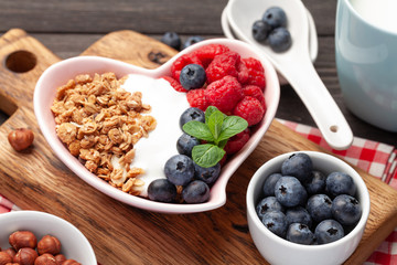Healthy breakfast with granola, yogurt and berries