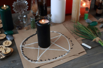 magic ritual with runes and pentagram and magical attributes