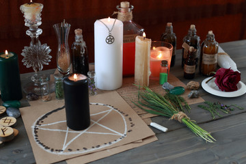 magic ritual with runes and pentagram and magical attributes