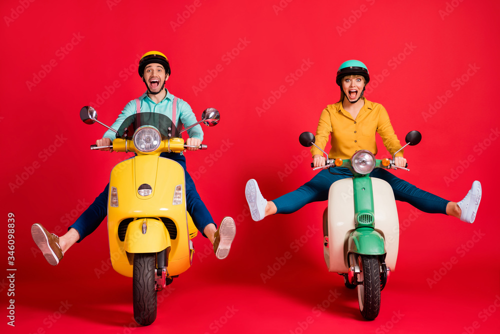 Wall mural portrait of nice attractive funky foolish careless cheerful cheery glad couple driving moped having 