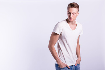 Obraz premium Sexy smiling male model against white background