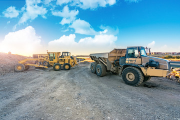 Excavator machine leveling the ground with a large shovel