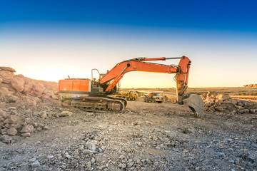 Excavator in a mining factory where stone is extracted