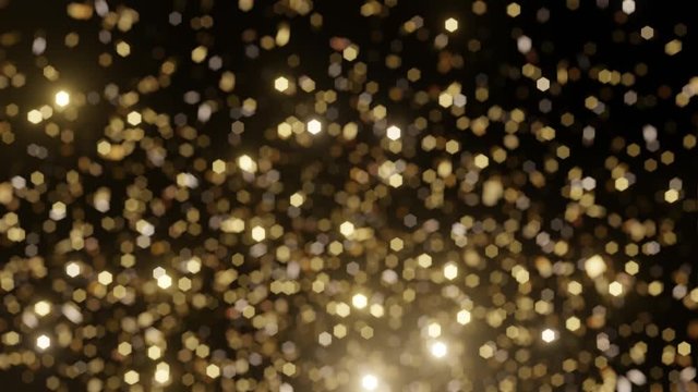 Defocus glitter background with gold slowly falling confetti. Confetti explosions on a black background. 4K animation