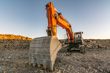 Excavator in a mining factory where stone is extracted